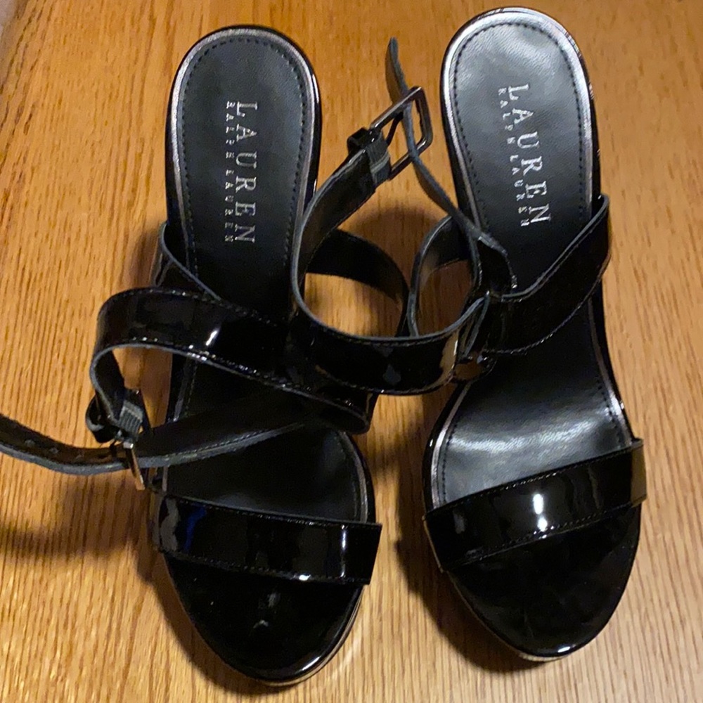 Black patent leather platform high heeled sandal.